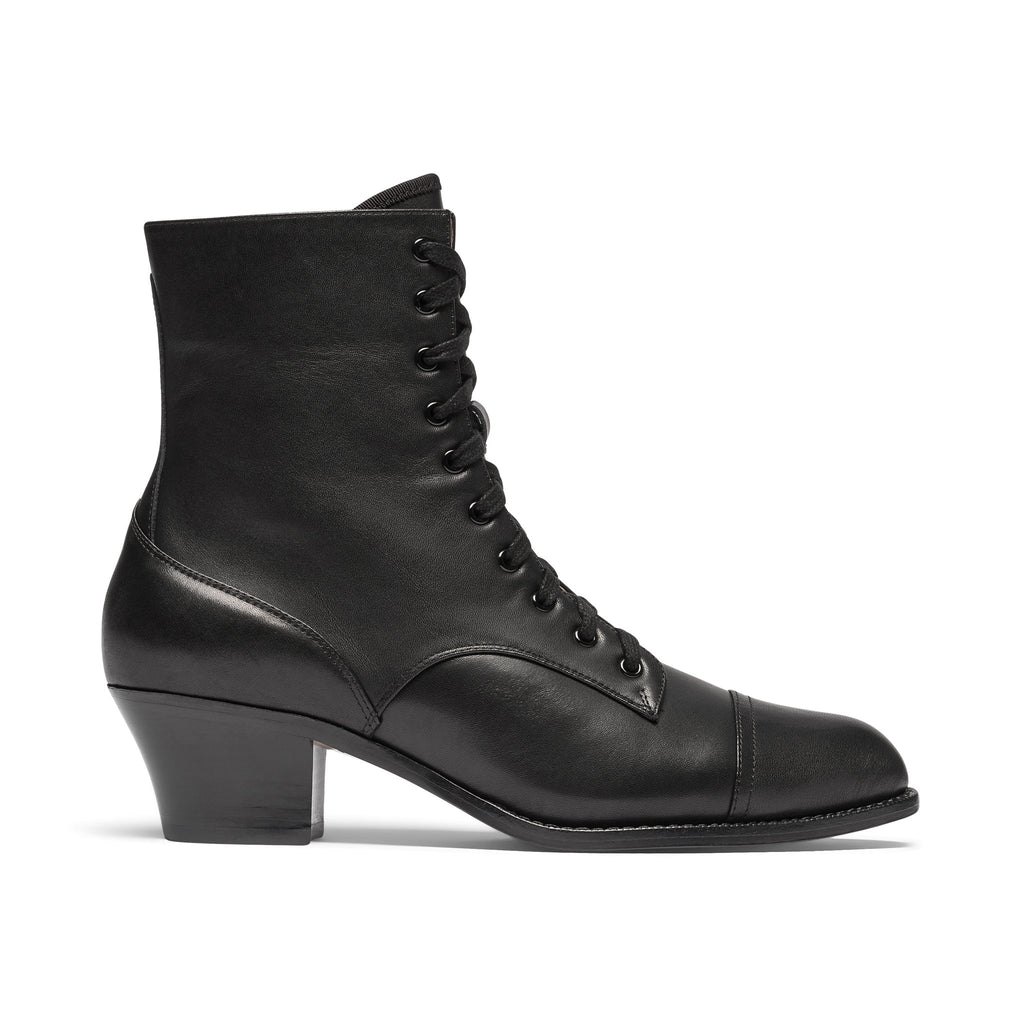 Red ankle boot on a light gray background