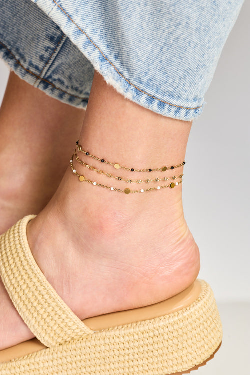 Anchors bracelet on a foot with a casual outfit