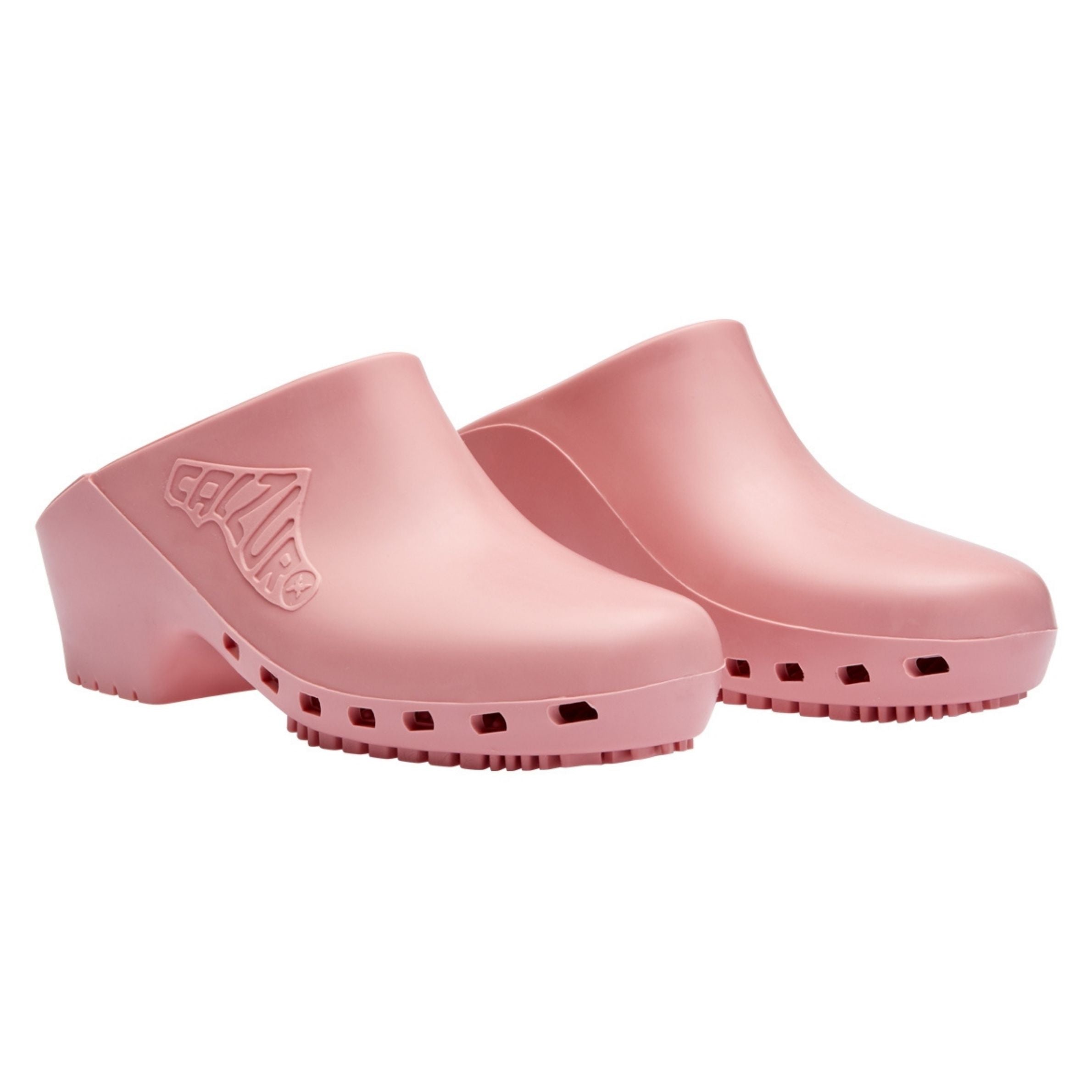 Pair of pink clogs on a white background