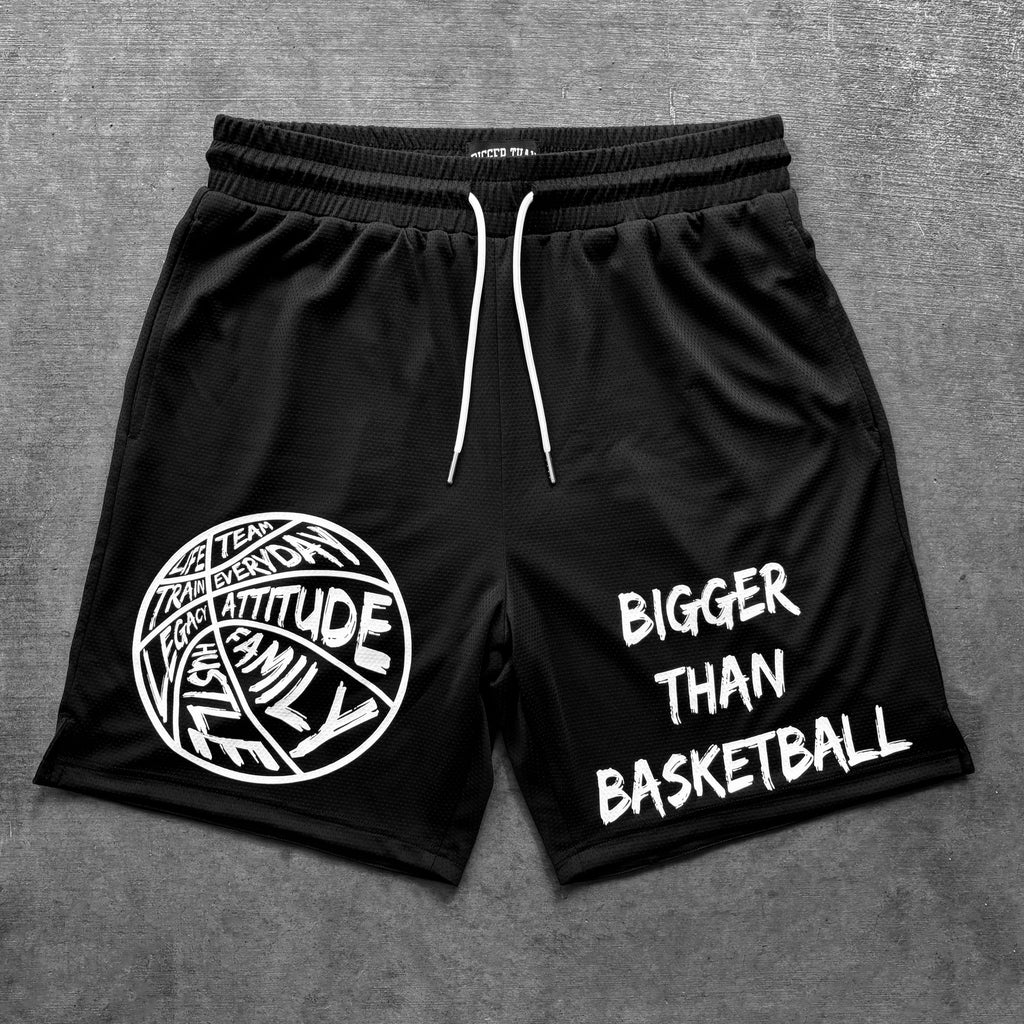Black shorts with white text and graphics on a gray background