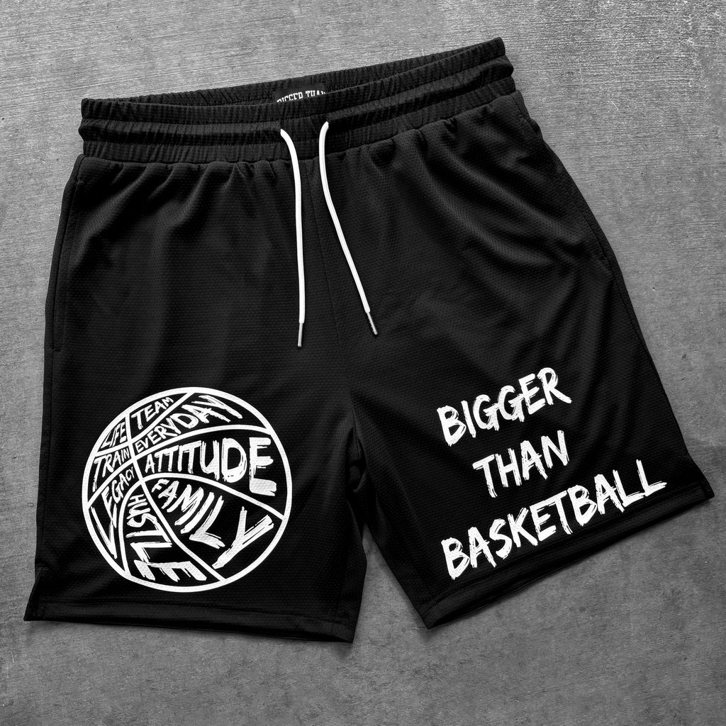 Black shorts with white text and graphics on a gray background