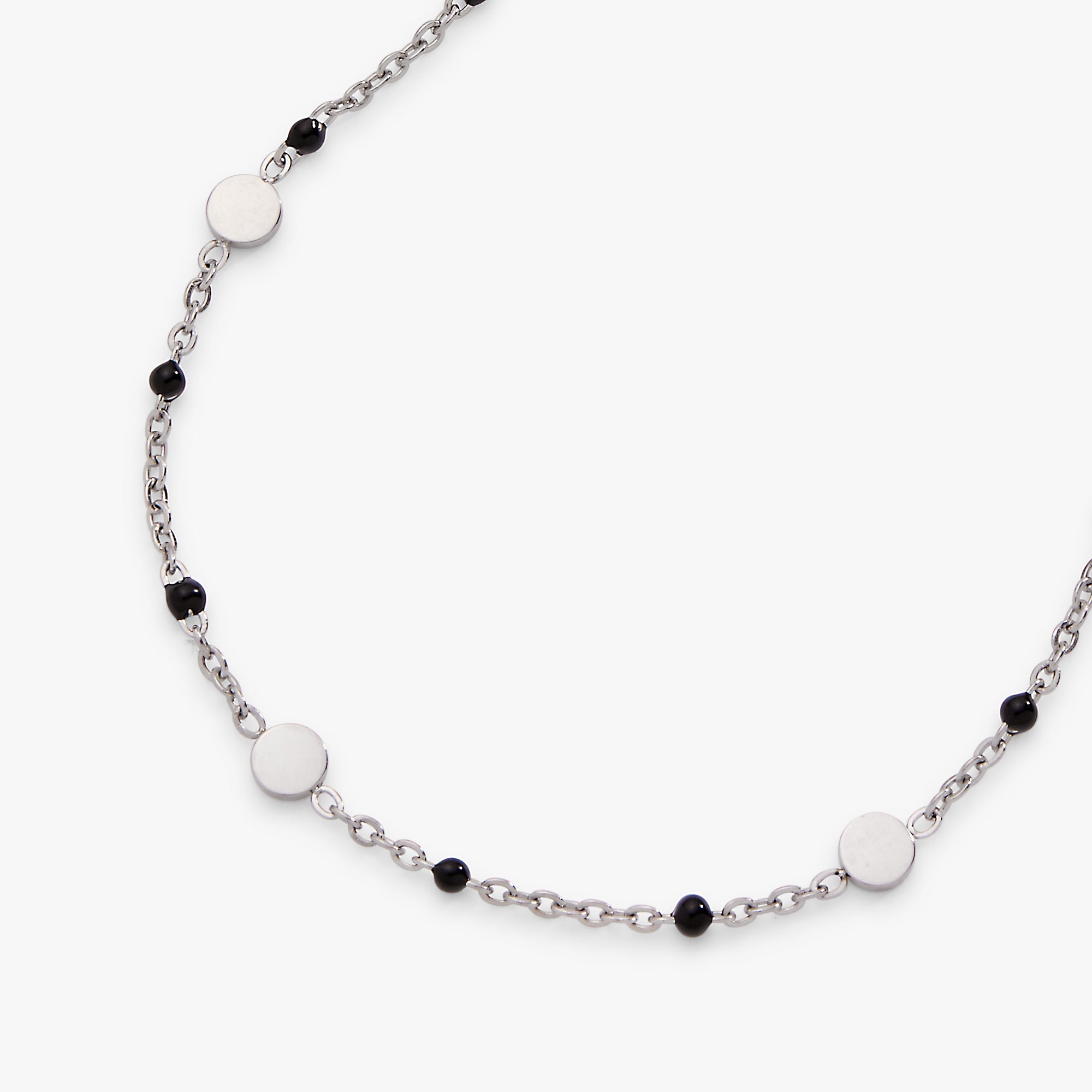 Necklace with white and black beads on a white background