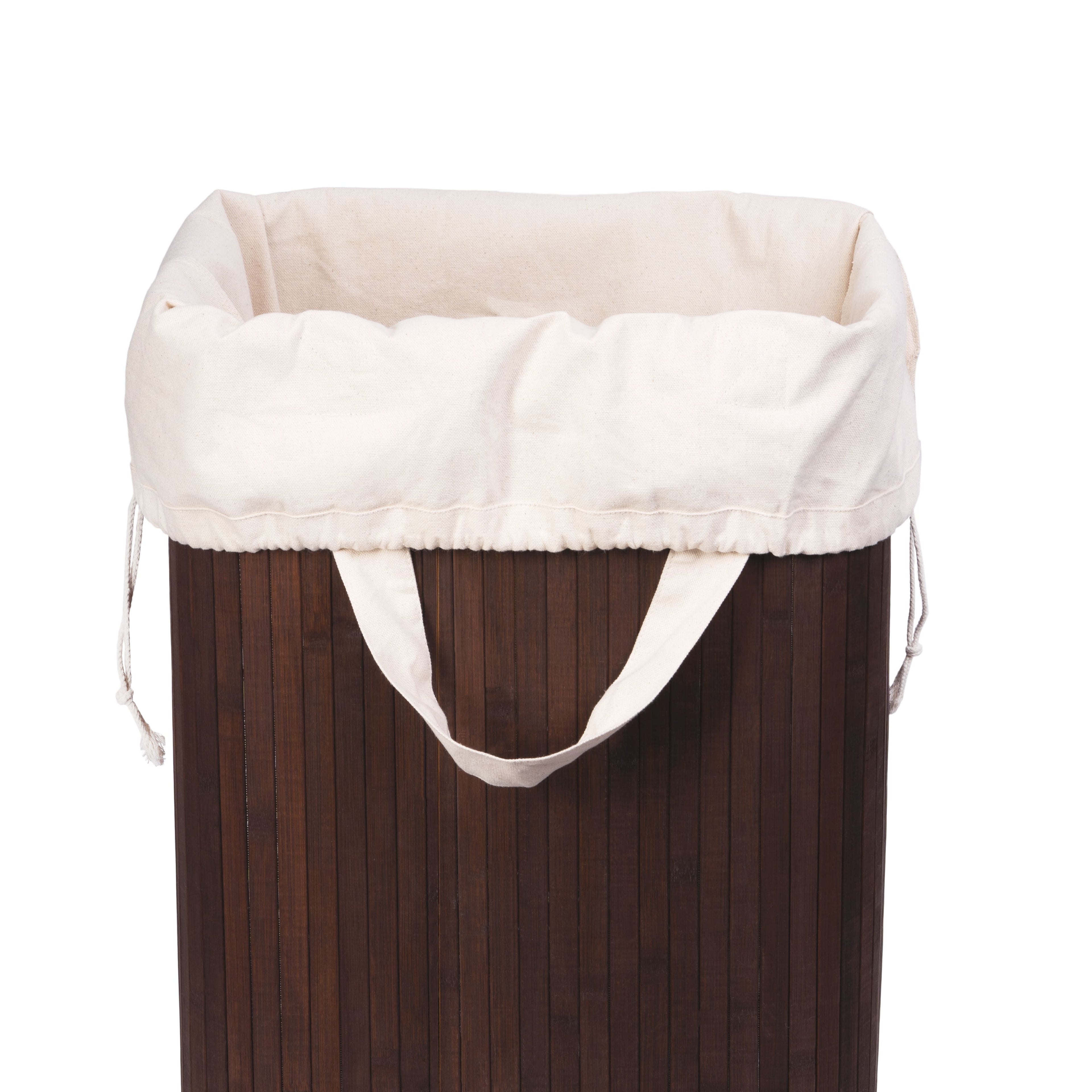 Wooden hamper with a white liner on a white background