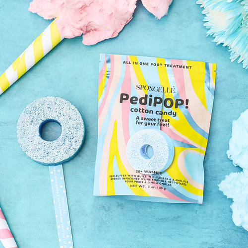 Spongellé PediPop! cotton candy foot treatment packaging on a blue background with decorative elements.