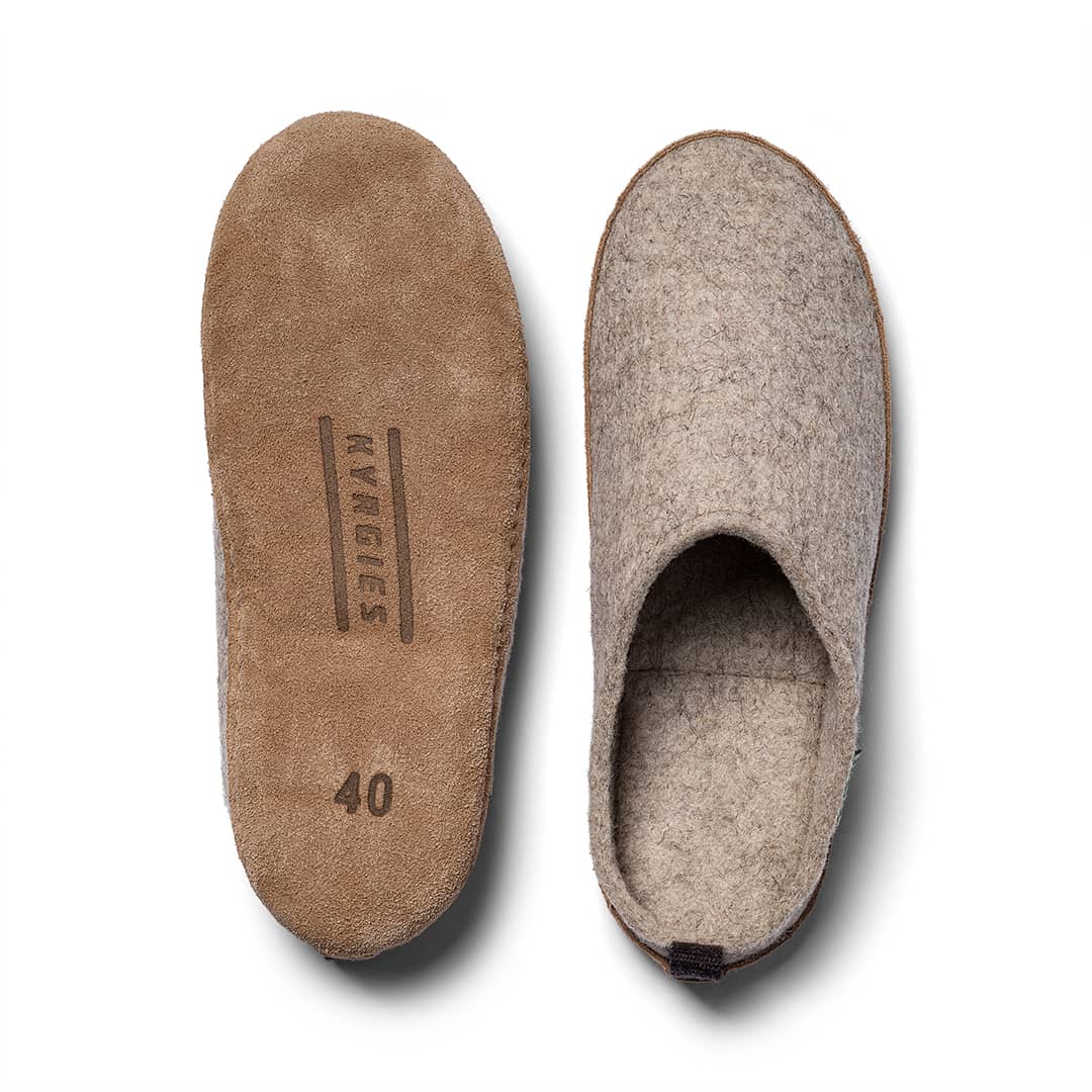 Pair of brown slippers with visible brand logo on a white background