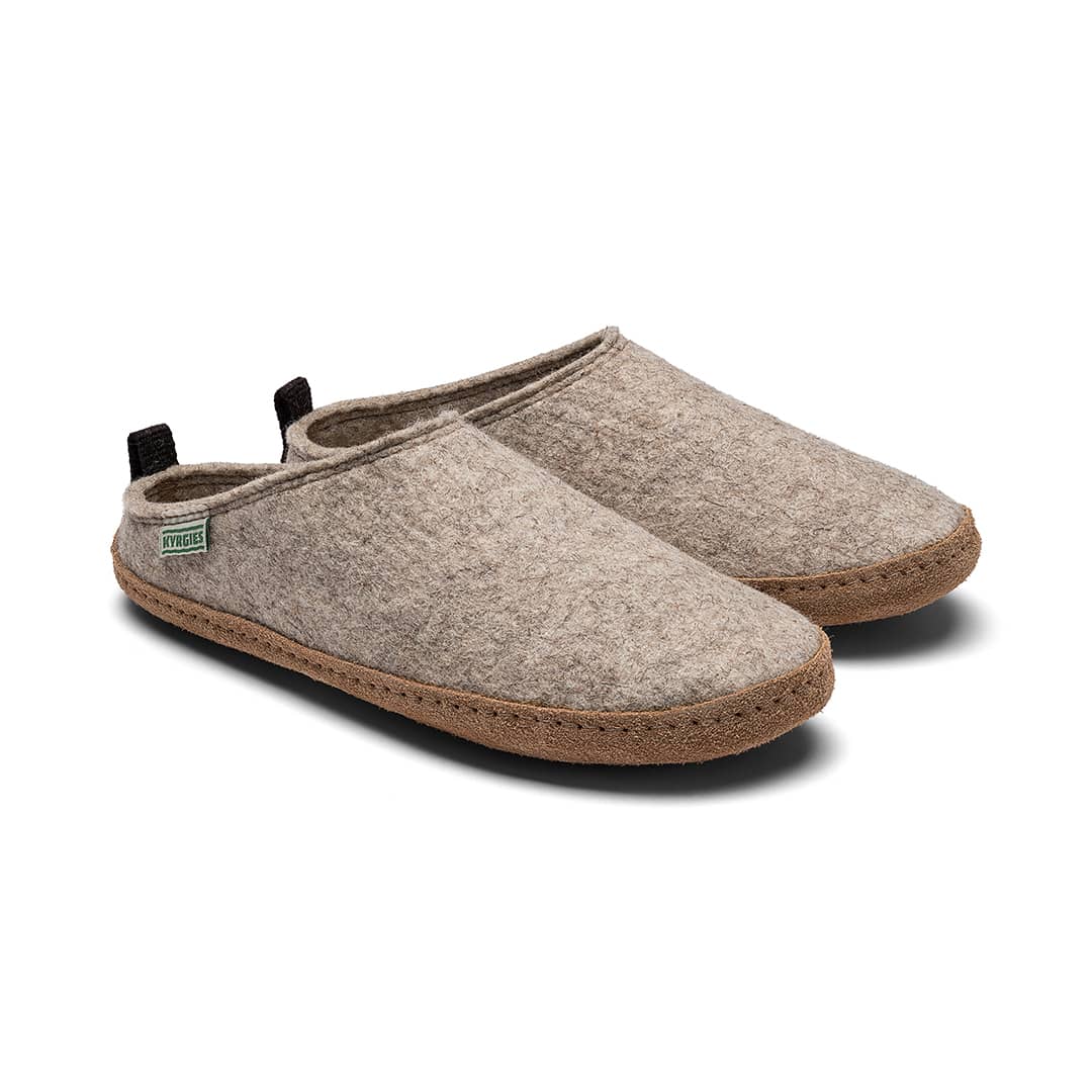 Pair of brown slippers on a white background