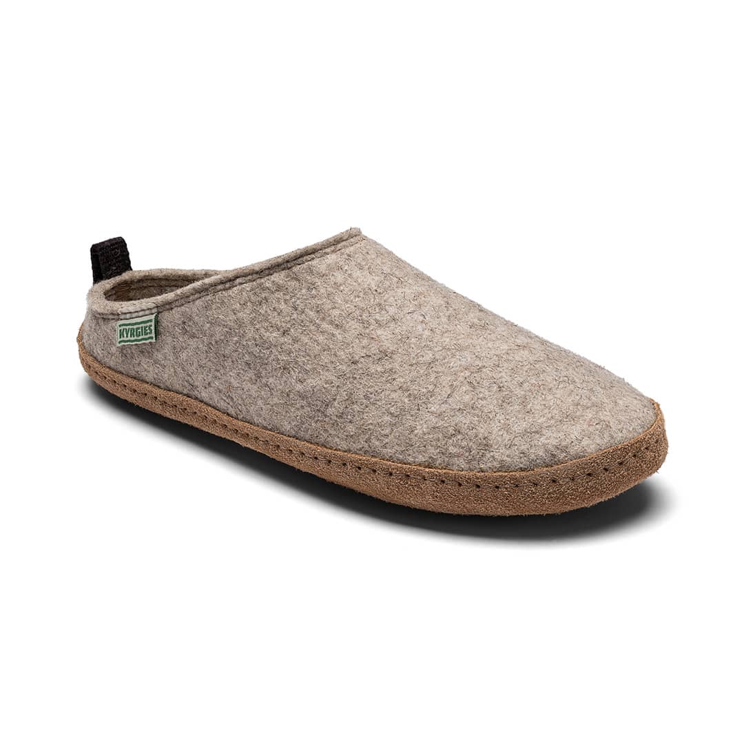 Beige slipper with a brown sole on a white background