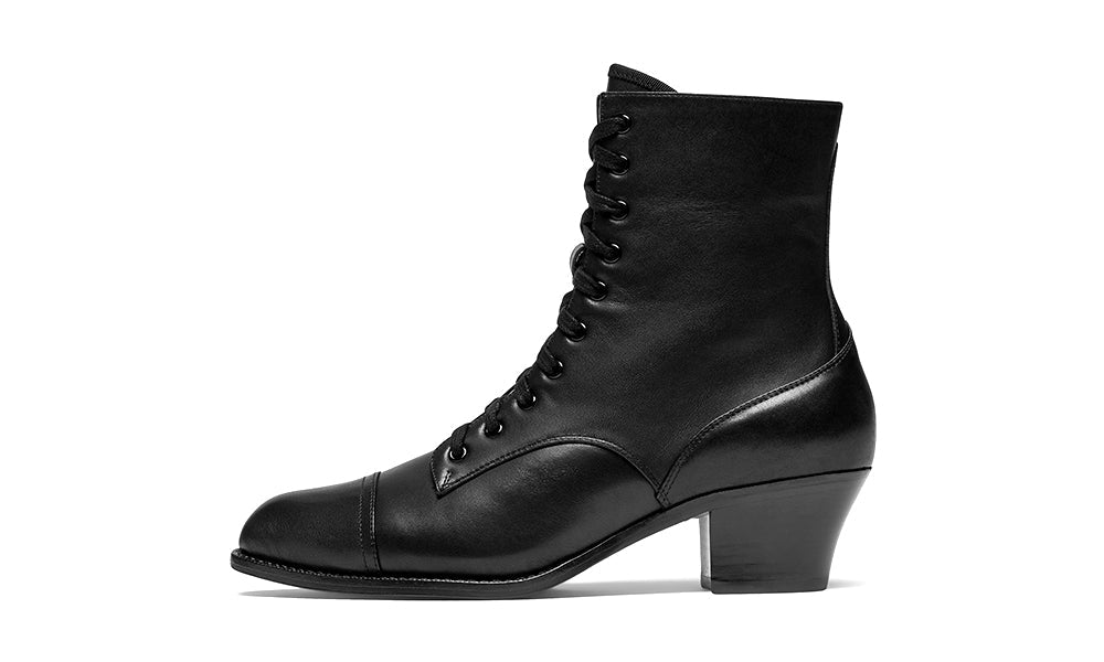 Black leather boot with lace-up design on a white background